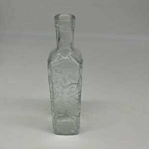 Clear Glass Bottle with Embossed Design
